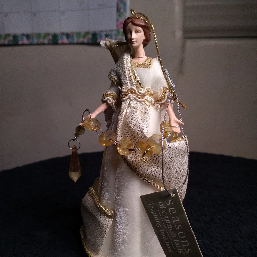 The winter Angel seasons ornimental figurine lady of winter imported